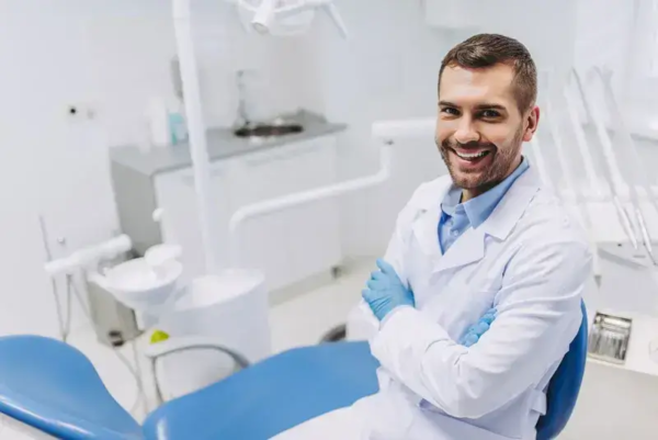 dentist smiling sitting in dental suite