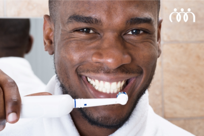 Manual vs Electric toothbrushes man brushing teeth