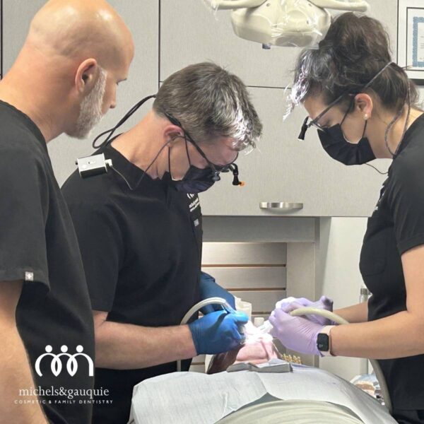 Dr. Harrington performing a dental implant procedure during treatment in Greenville, NC
